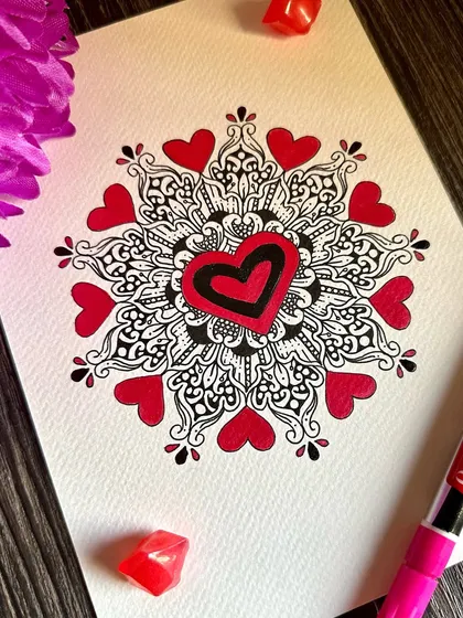 This heart-themed mandala is another piece from my Valentine's series. The central heart is surrounded by smaller hearts and detailed black linework, creating a beautiful and romantic design.