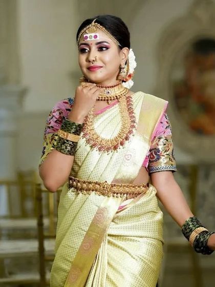 A classic bridal portrait. The choker and haram combination is a timeless choice for South Indian weddings.