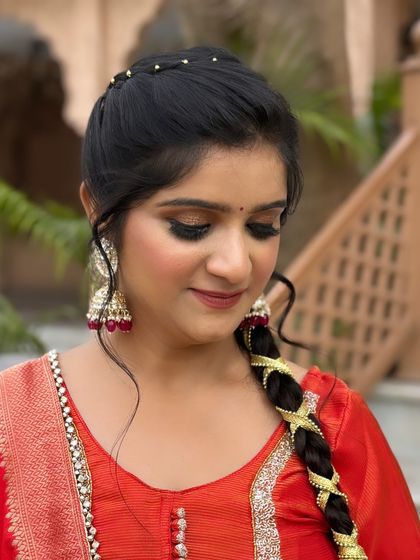 Another angle of this stunning look, highlighting the shimmer on the eyelids and the flawless base makeup.