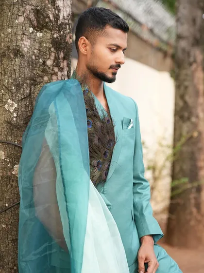 A close-up profile shot, highlighting the texture of the suit and the serene expression.