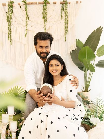 A beautiful portrait of a new family of three. I provide gentle guidance on posing to ensure everyone looks their best while keeping the interaction feeling natural and full of love.