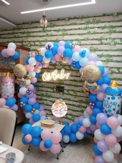 An 'Oh Baby' balloon ring in shades of blue, pink, and purple, perfect for a baby shower or gender reveal.