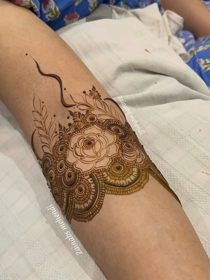 A close-up of a beautiful armband for bride Nida, featuring a delicate rose with negative space detailing.