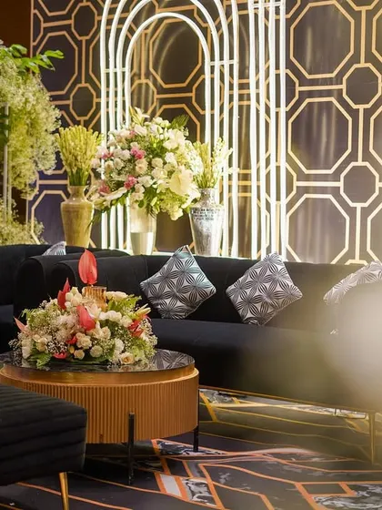 Another angle of the lounge seating, showing the plush textures and metallic accents that contributed to the luxurious feel of the event.