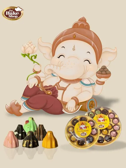 A modern twist for Ganesh Chaturthi, our Chocolate Modak collection is a festive favorite. This image showcases our variety of handcrafted modaks, available in gift boxes that are perfect for offering as prasad or sharing with loved ones.