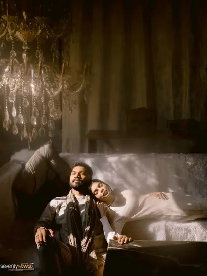 Bathed in the soft, dramatic light of a Kashmiri room, they find a moment of peace. This is a portrait that feels like a painting, full of mood and quiet romance.