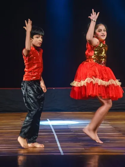 Two of our youngest dancers captured in a moment of joyful movement. This shows that even the smallest performers can learn to express themselves and shine on stage with our guidance.