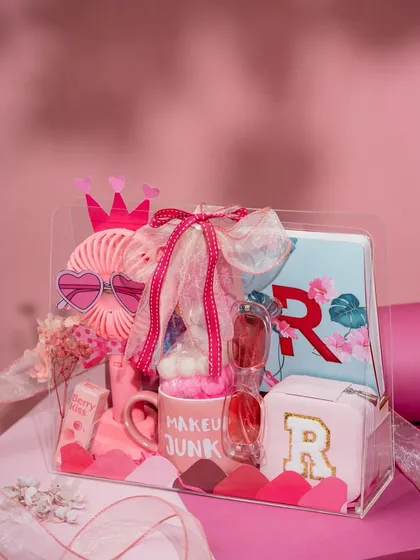 Gifting for little ones is all about sparking imagination. This 'Pretty in Pink' hamper is filled with personalized goodies, from a monogrammed pouch and mug to fun accessories, creating a truly special treat for a little princess.