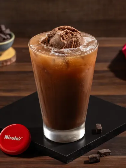 A rich chocolate ice cream soda, a decadent and refreshing treat.