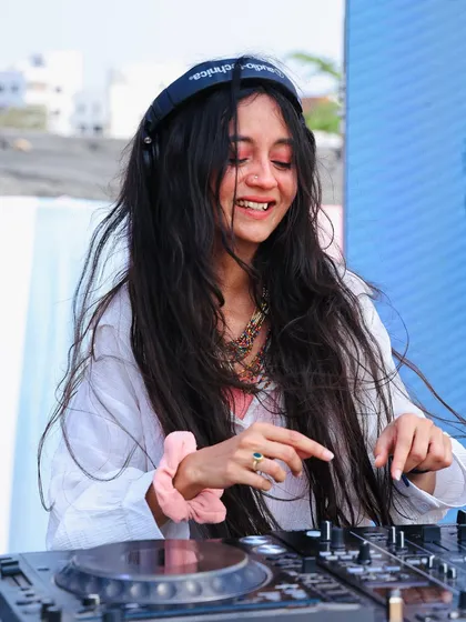 A happy, sun-kissed shot from a Holi gig. You can see the colors on my face. These parties are all about letting go and having fun.