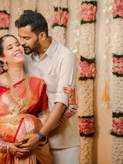 The joy and love between a couple are the heart of any baby shower. This candid shot captures a happy, loving embrace during a traditional Valaikaappu ceremony, showing the genuine connection we aim to photograph.
