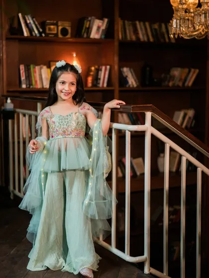Capturing the pure joy of childhood is a privilege. For this kids' couture brand shoot, we created an elegant, festive atmosphere where this little model's bright smile and the dress's delicate details could truly shine.