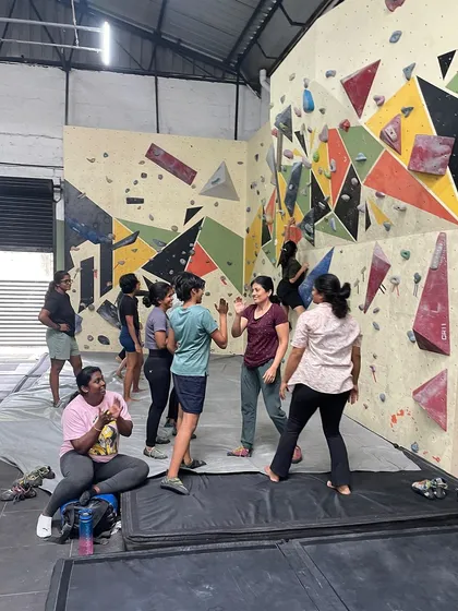 High fives and cheers after a successful climb! Celebrating each other's victories, big or small, is a huge part of our community culture.