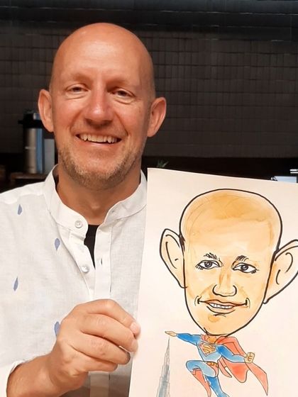 The joy is universal! This gentleman from the Google Cloud team was thrilled with his Superman caricature, a fun memento from the office event.