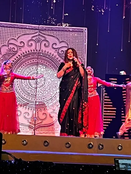 A wide shot of my performance, showing the synergy between my singing and the graceful dancers on stage. Together, we tell a story through music and movement.