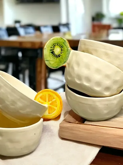 I love adding a playful twist to everyday items. These quirky, handmade bowls feature sculpted kiwi and orange slice handles, bringing a bit of fun and unique character to your kitchen and dining table.