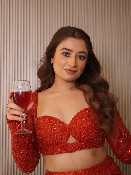 The power of red is undeniable. Here is a toast to new beginnings in our stunning, fully hand-embroidered red lehenga, perfect for a cocktail or reception look.