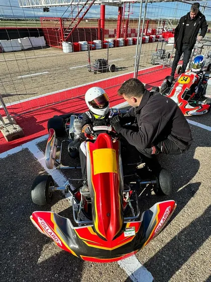 A close-up of our driver receiving coaching in his Gillard chassis kart.