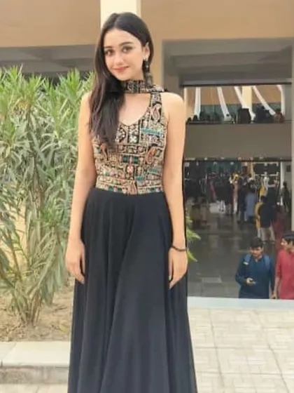 A chic and modern black gown with a beautifully embroidered sleeveless top. This is a great rental option for a formal event or a friend's reception.
