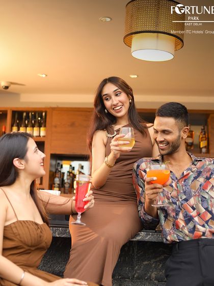 Laughter and good times are always on the menu at Neptune. Here, friends gather at the bar to share drinks and make memories.