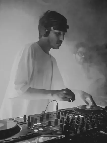 Caught in the zone during a set for Dance Ok Please. For me, it's about creating an atmosphere where the music takes over, blending deep cuts and heavy basslines to keep the floor moving. This black and white shot perfectly captures that smoky, intense club vibe.