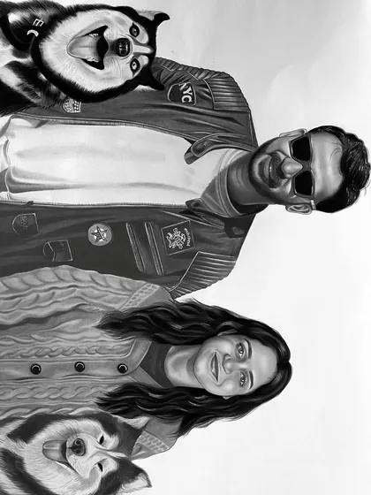 The final charcoal sketch of the couple and their two dogs, created by combining five photos. This piece took over 15 hours to complete, ensuring every detail was just right.