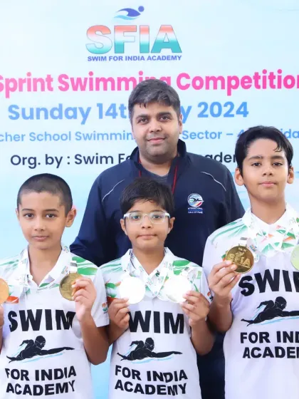 With some of our medal winners. Seeing their happy faces with their medals is the best part of being a coach.