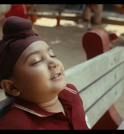 A beautiful, candid moment from the Zomato film. The little boy's school uniform, complete with a turban, was styled to look natural and lived-in.