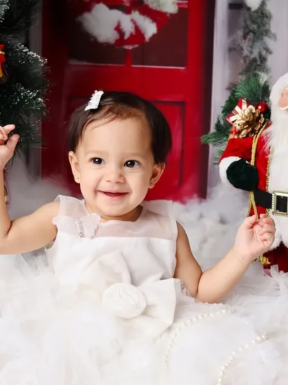 Another happy moment from the winter wonderland first birthday session, capturing a big smile.