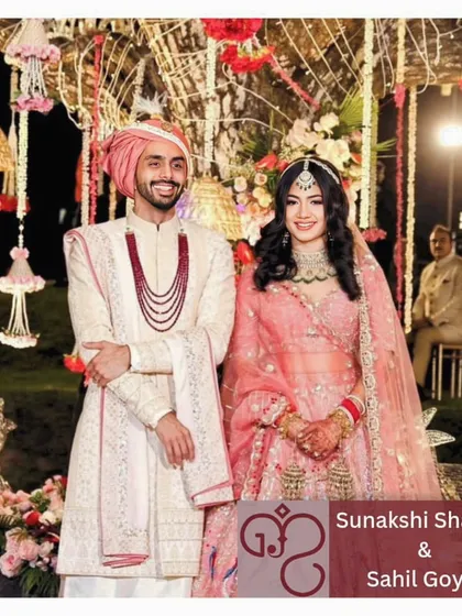 This couple's smile is the spark that ignites my enthusiasm each day. Dressed in elegant pink and white, their happiness reminds me of the impact of creating perfect matches.