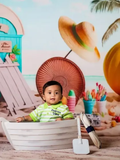 A day at the beach, right in our studio. This vibrant and fun beach theme is perfect for bringing summer vibes to your baby's photoshoot.