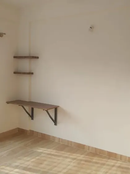 I also work on smaller wooden fixtures, like this wall-mounted study desk and shelving unit, providing a durable finish for everyday use.