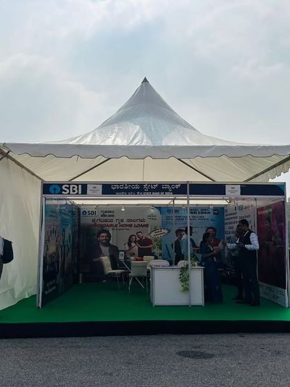 An exhibitor booth setup within a pagoda tent at the EV Expo. We provide complete solutions for expos, including structured tents and interior setups for partners and sponsors like SBI.