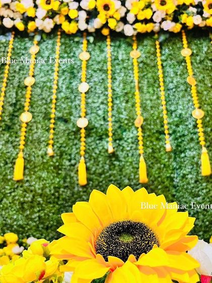 A close-up of the sunflower and tassel details from the grand Haldi setup, showcasing the quality and vibrancy of the decor elements.
