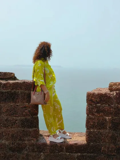 A travel portrait taken at a fort in Goa with the Oppo Reno 11 Series. This shot combines portraiture with a sense of place, ideal for travel-focused content.