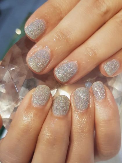 Another example of how beautifully dip powder works on short nails. This silver glitter set is perfect for adding some sparkle while protecting and strengthening your natural nails.
