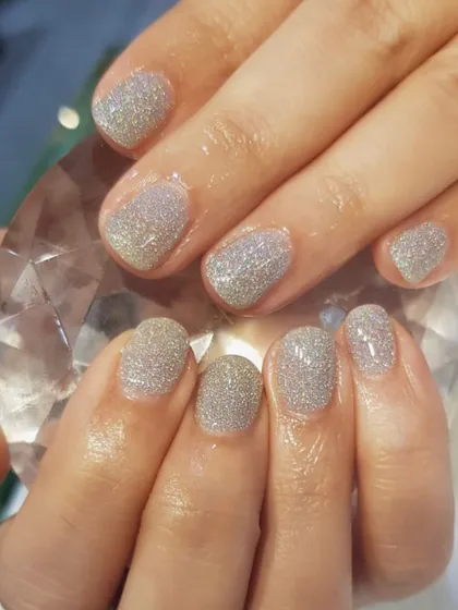 Another example of how beautifully dip powder works on short nails. This silver glitter set is perfect for adding some sparkle while protecting and strengthening your natural nails.