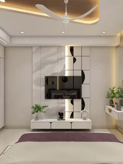 The TV unit in this bedroom is sleek and modern, with a floating dressing table beside it. The design is clean, functional, and saves space.