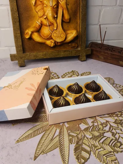 For Ganesh Chaturthi, I offer a modern twist on tradition with these centre-filled chocolate modak tarts. Each tart has a buttery crust and is filled with rich, indulgent chocolate, making it a perfect offering for Bappa.