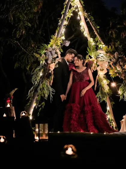 Let's create a fairytale romance for your pre-wedding shoot. This couple looks absolutely magical in our deep red gown, set against a beautifully lit, intimate night scene at my studio. This is the perfect example of the dreamy, filmy vibe we can achieve together.