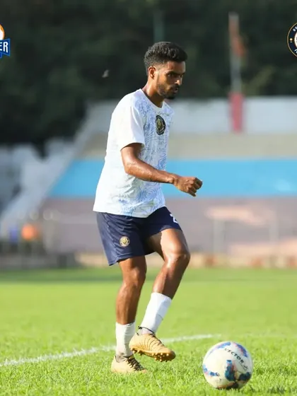 A player controls the ball with precision, ready to contribute to the team's attack.