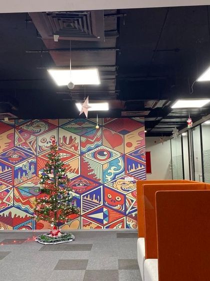 A Christmas tree setup in an office, adding a festive centerpiece to the workspace.