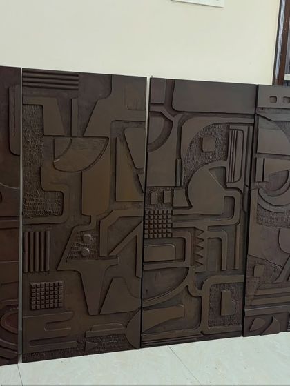 The four dark textured panels from the Jaipur project, seen here in my studio. This shows how the pieces are designed to align and create a continuous abstract narrative when installed together.