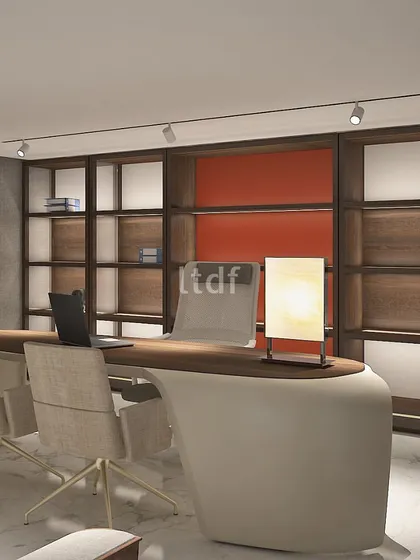 This home office captivates with its harmonious blend of vibrant and minimalist color tones. Bold pops of color from the red desk invigorate the atmosphere, while clean lines and subtle hues in the cabinetry maintain a sense of calm and focus.