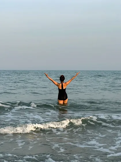 Embracing the vastness of the ocean. There is a powerful sense of freedom and surrender that comes from standing in the sea, letting the waves wash over you.