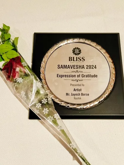 The beautiful "Expression of Gratitude" plaque presented to me by Bliss. These moments are a cherished part of my journey as an artist.