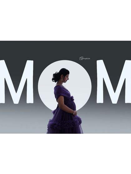 A creative studio portrait with a "MOM" text overlay and a silhouette of the mother-to-be against a circular light.
