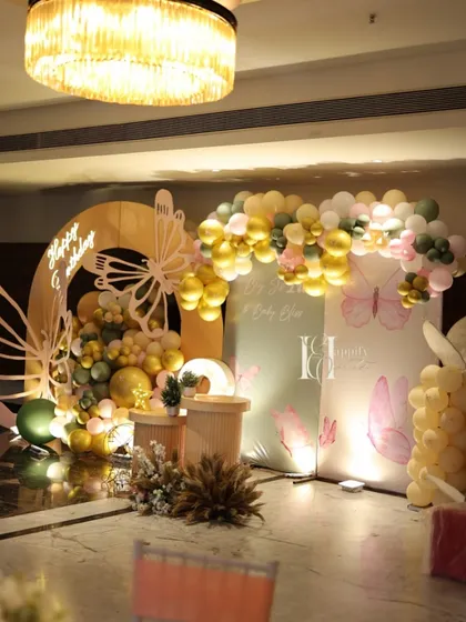 The full butterfly-themed setup, showing how different elements like backdrops, props, and lighting come together to create an enchanting atmosphere.