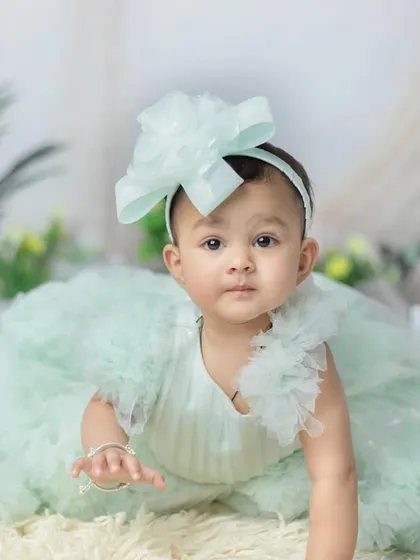 This little princess is ready to explore. The soft mint green dress and ruffled details are just gorgeous.