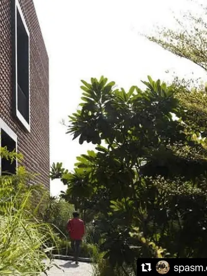 A resident enjoys a quiet moment on a path we designed for the Ishtika project. The surrounding greenery provides a sense of escape and connection to nature, even within the confines of the property.